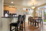 Seated dining for seven, breakfast bar for two w granite counter tops